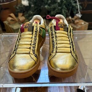 L.A.M.B. gold sneakers by Gwen Stefani size 9-no box.